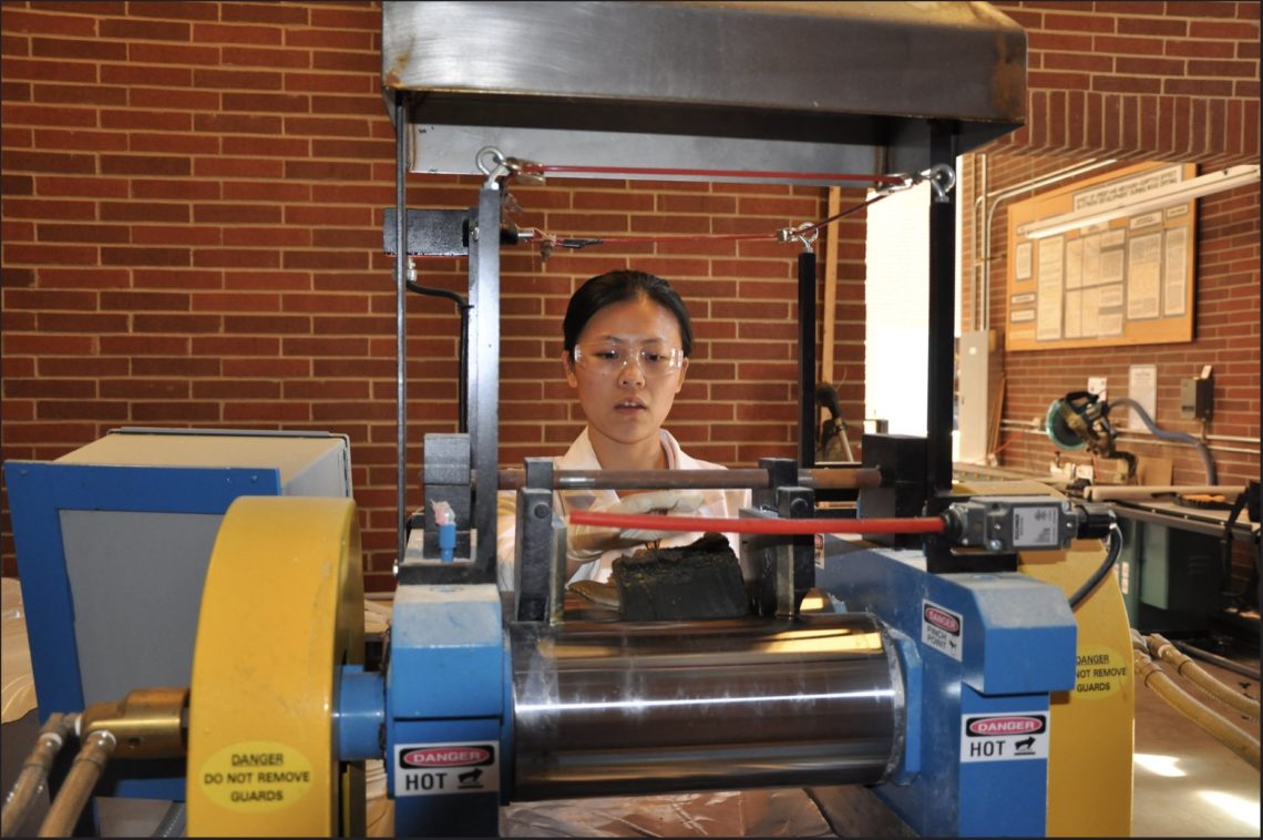 OSU doctoral student Wen Bai develops rubber composites in an OSU laboratory