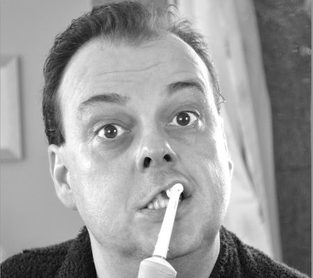 natural or chemical toothpaste, man brushing